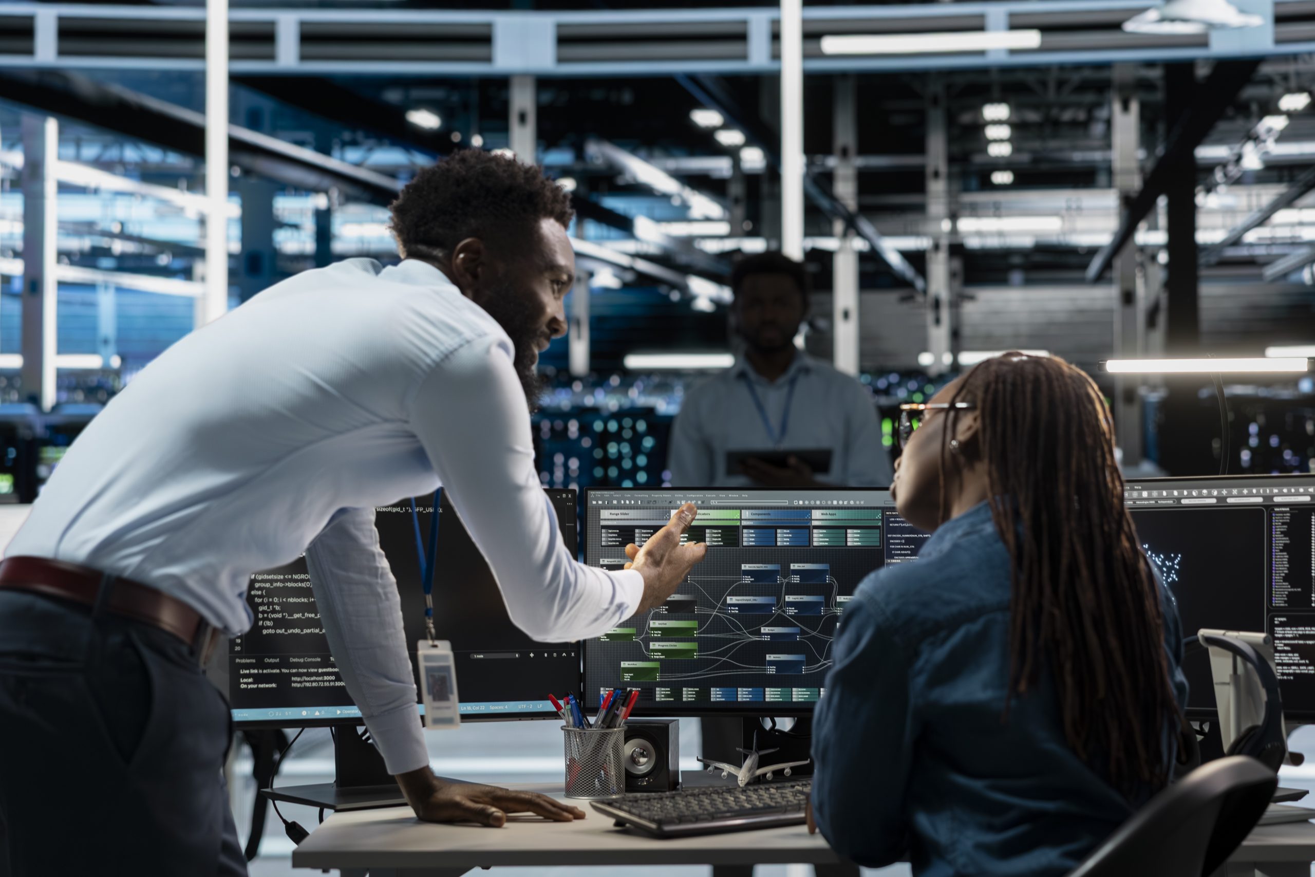 server farm team leader overseeing work done by expert upgrading ai systems